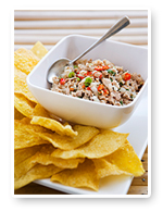 Fresh spicy tuna salad topped with crispy wonton chips, bursting with herbs and beachside flavor.