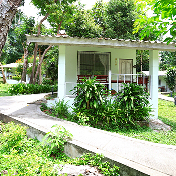 Modern air-con bungalow at Tubtim Resort surrounded by palm trees